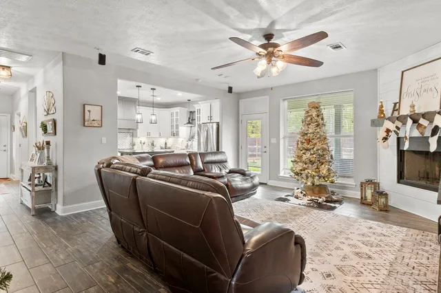 a living room with furniture and window