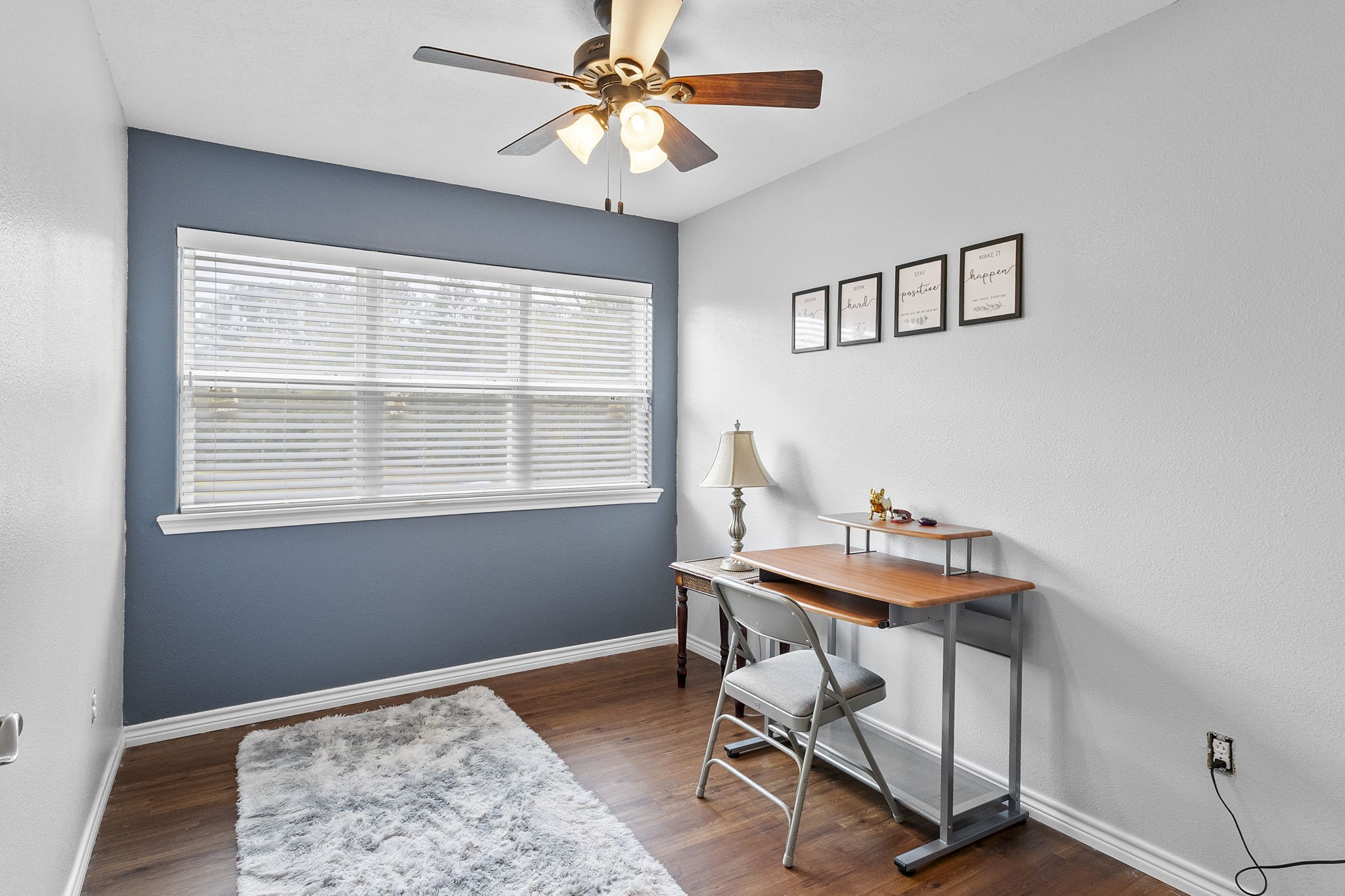 6938 Old Honey Island Road Kountze, TX 77625 - Photo 22 of 34 a workspace with chandelier fan and a window