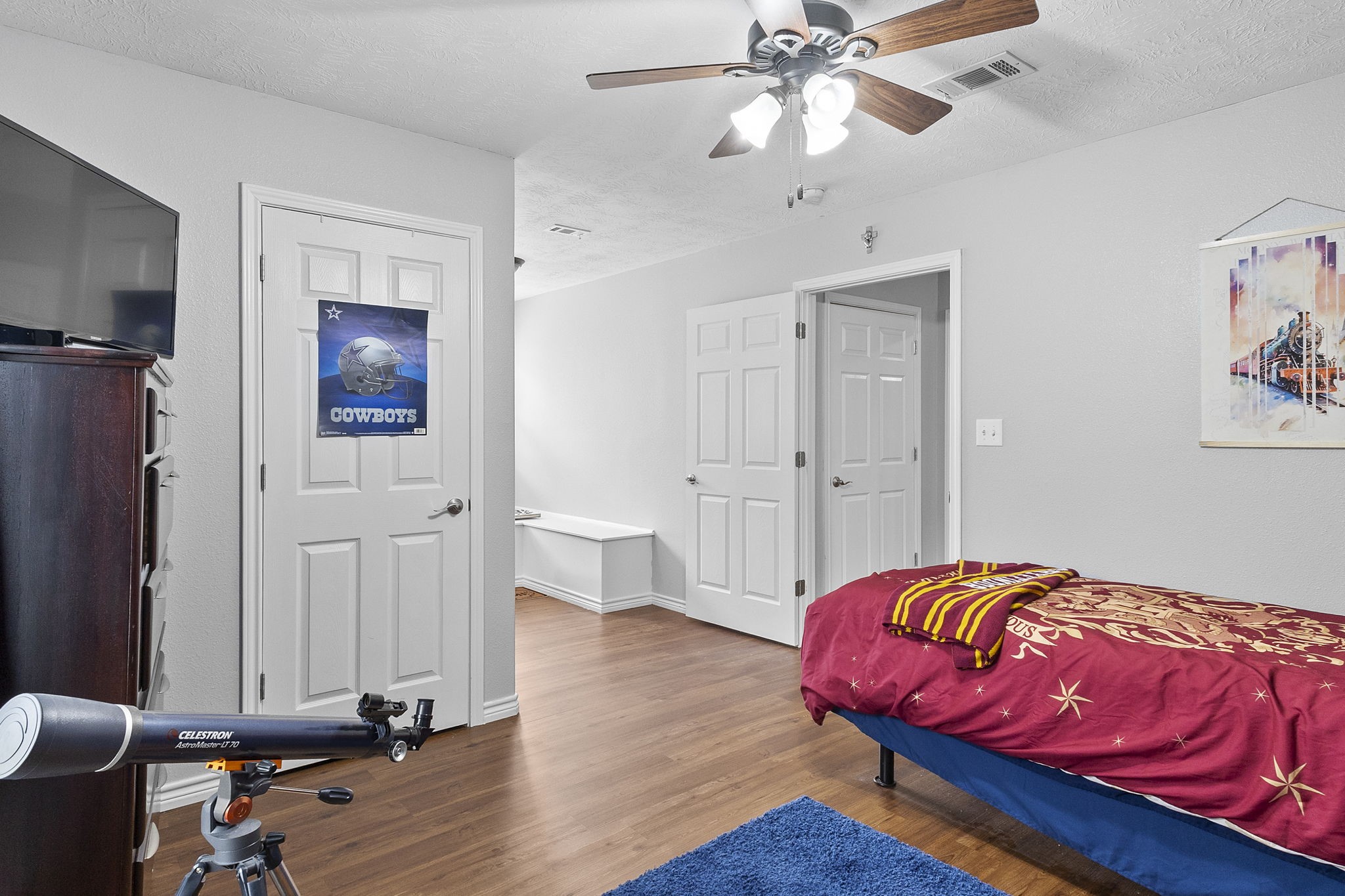 6938 Old Honey Island Road Kountze, TX 77625 - Photo 27 of 34 a bedroom with a bed and wooden floor