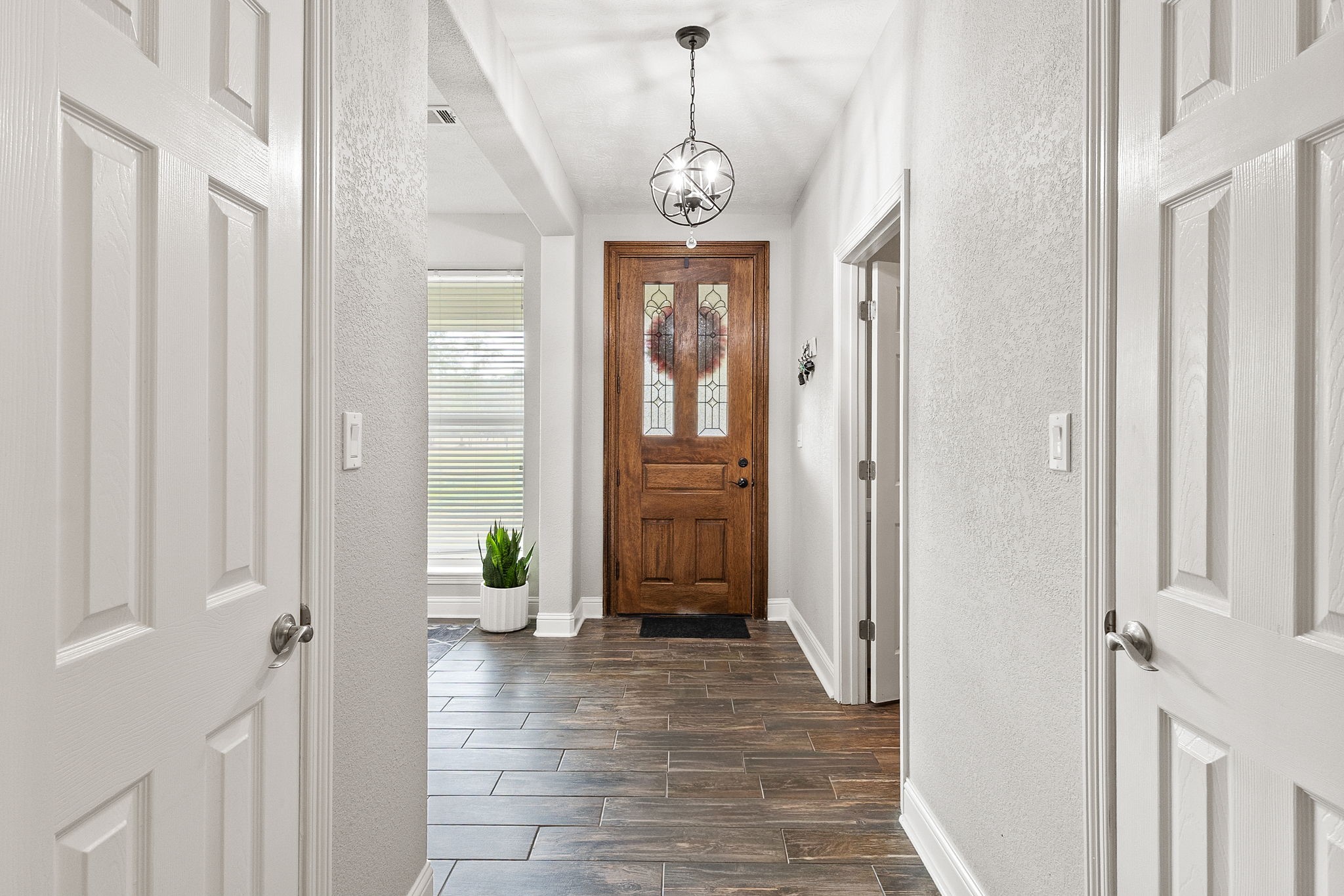 6938 Old Honey Island Road Kountze, TX 77625 - Photo 3 of 34 a view of an entryway with wooden floor
