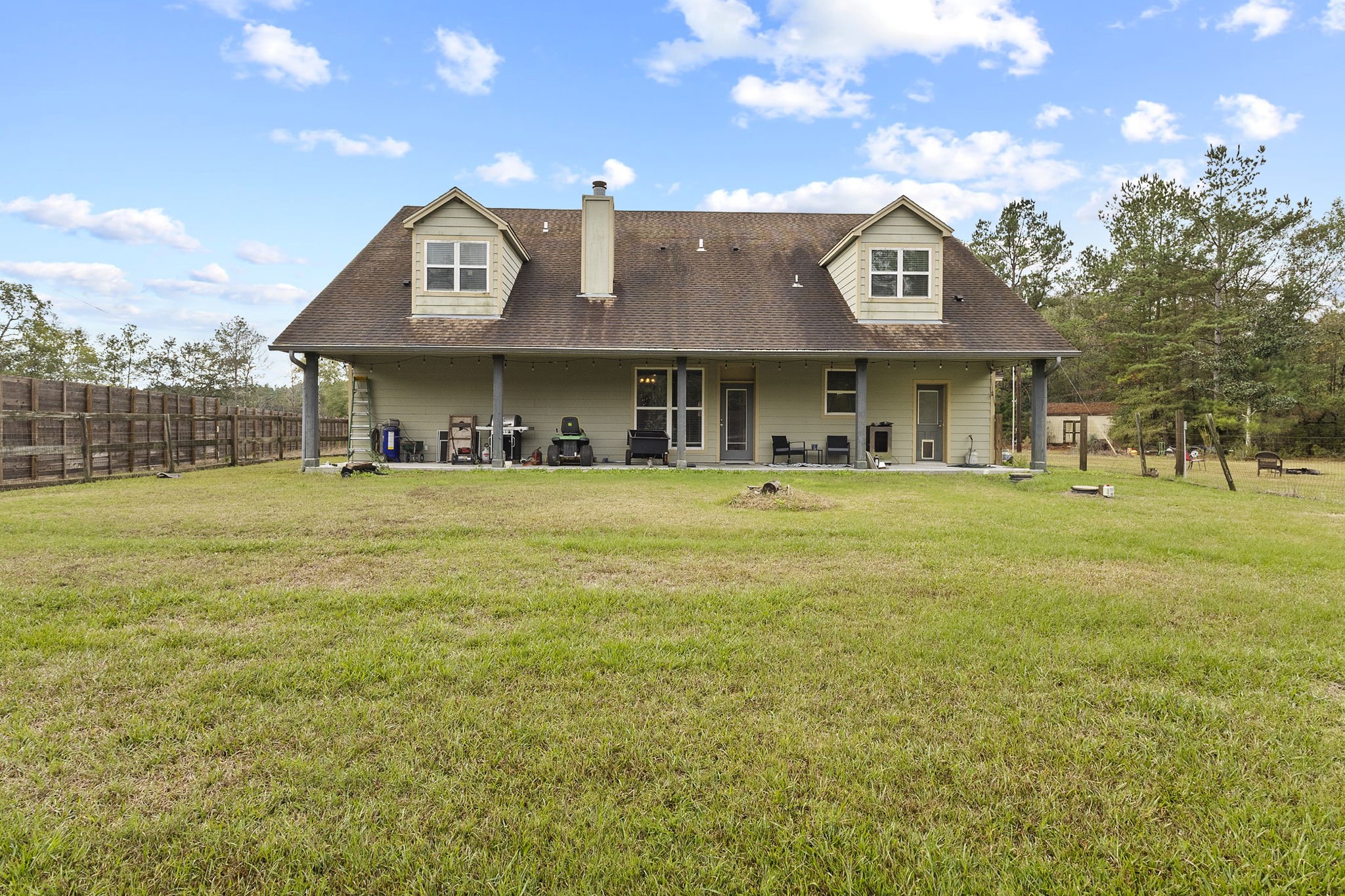 6938 Old Honey Island Road Kountze, TX 77625 - Photo 33 of 34 a view of a house with a yard