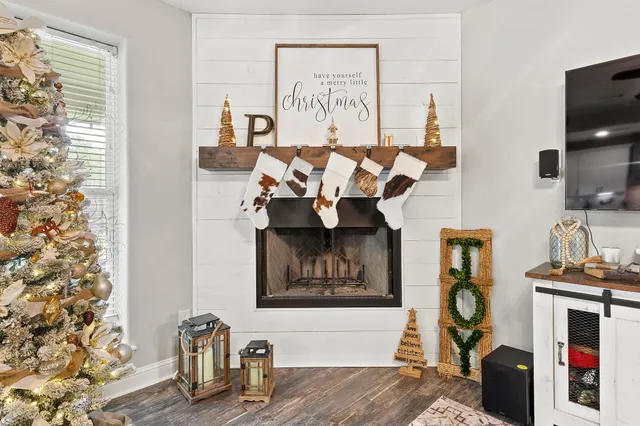 a bedroom with furniture and wooden floor