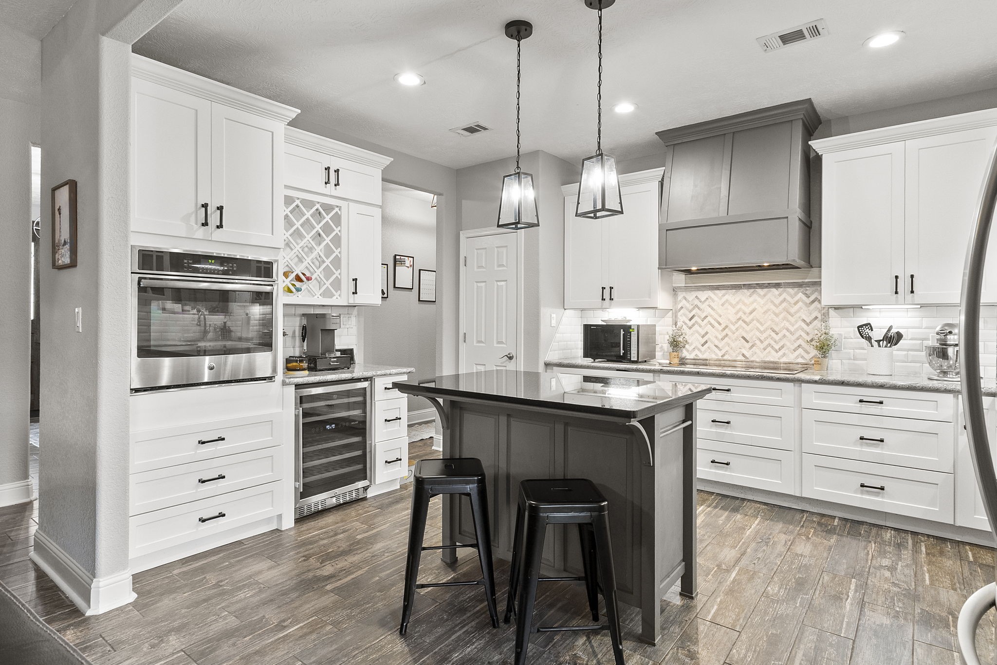 6938 Old Honey Island Road Kountze, TX 77625 - Photo 10 of 34 a kitchen with stainless steel appliances a stove a sink island and a refrigerator