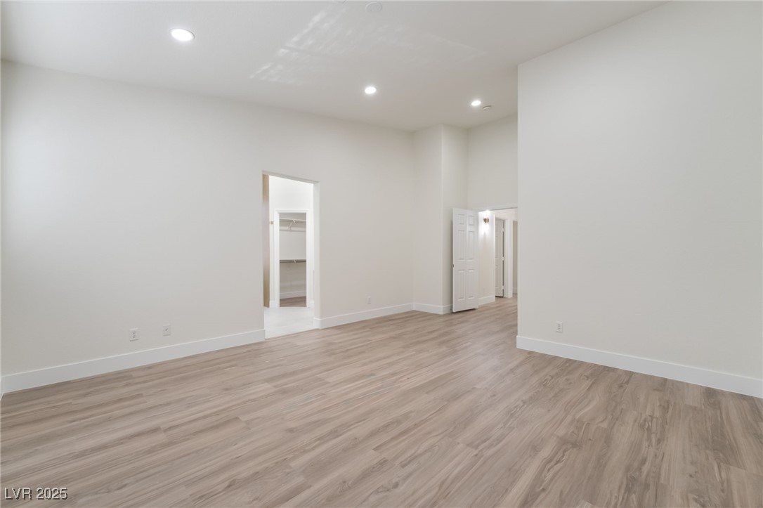 9205 Desert Village Avenue Las Vegas, NV 89147 - Photo 20 of 44 Unfurnished room featuring light wood-style floors and recessed lighting