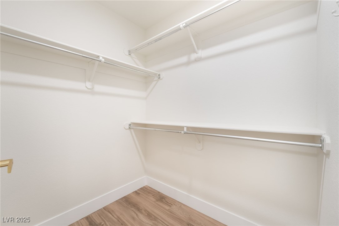 9205 Desert Village Avenue Las Vegas, NV 89147 - Photo 26 of 44 Walk in closet with light wood finished floors