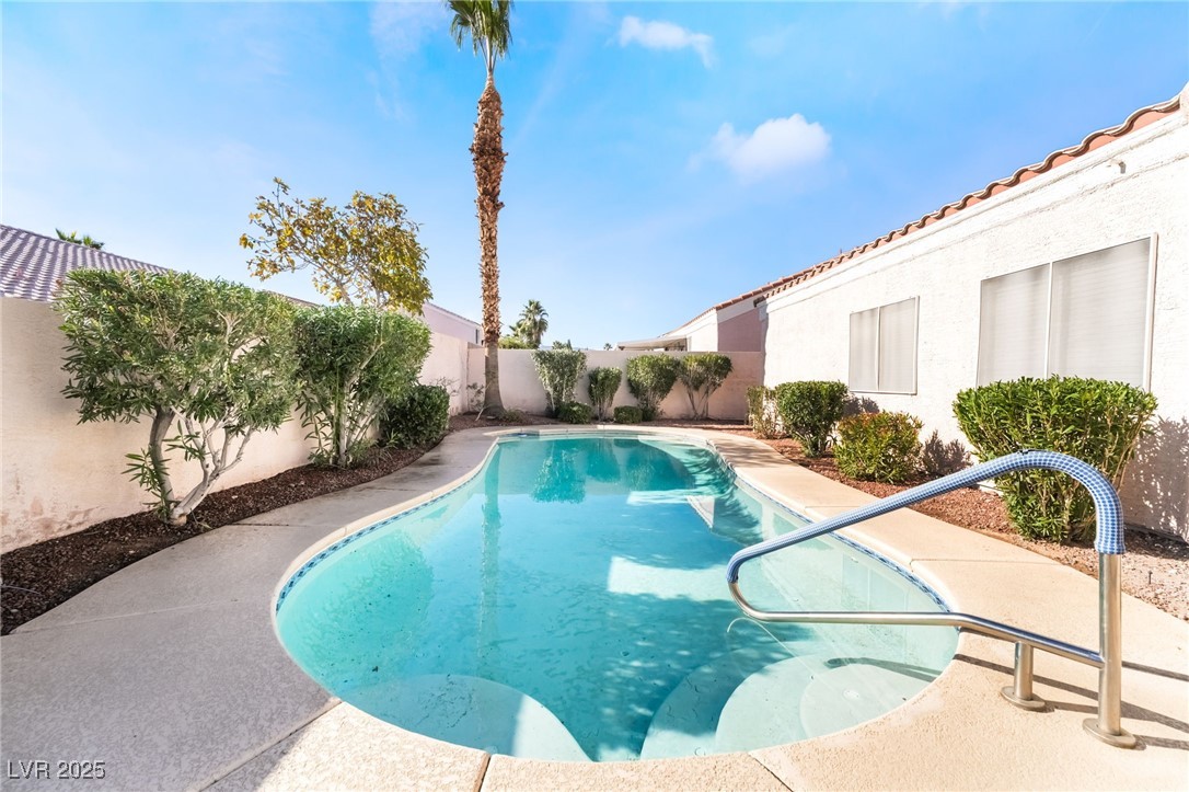9205 Desert Village Avenue Las Vegas, NV 89147 - Photo 37 of 44 View of swimming pool featuring a fenced backyard and a patio area