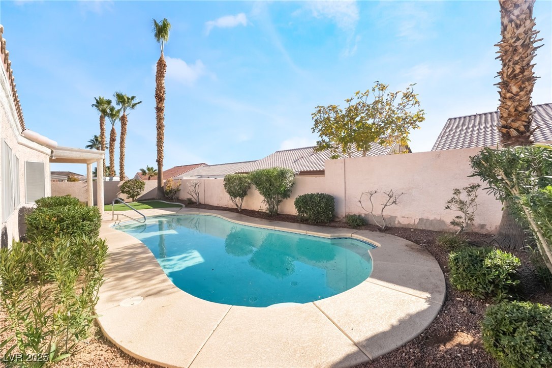 9205 Desert Village Avenue Las Vegas, NV 89147 - Photo 39 of 44 View of pool with a fenced backyard and a patio
