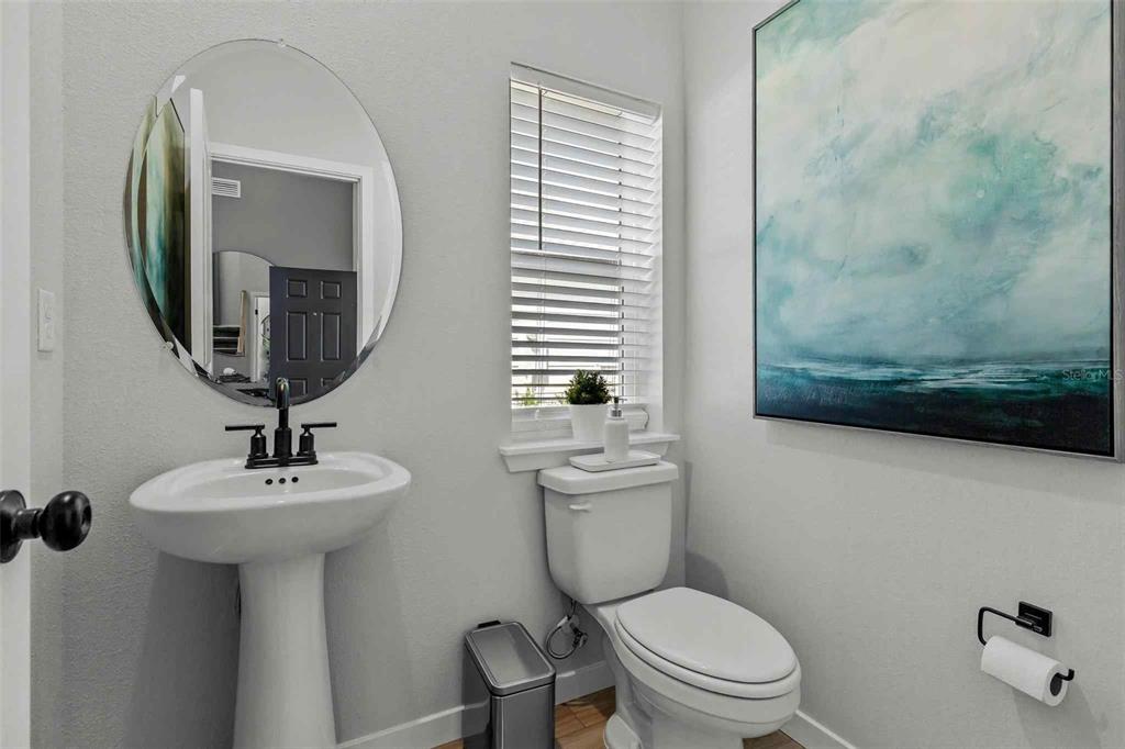 89 Pegasus Road Flagler Beach, FL 32136 - Photo 12 of 35 a bathroom with a toilet a sink and mirror