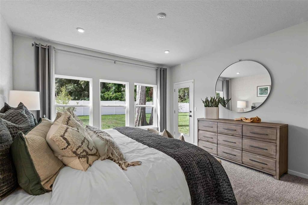 89 Pegasus Road Flagler Beach, FL 32136 - Photo 28 of 35 a bedroom with a large bed and a dresser