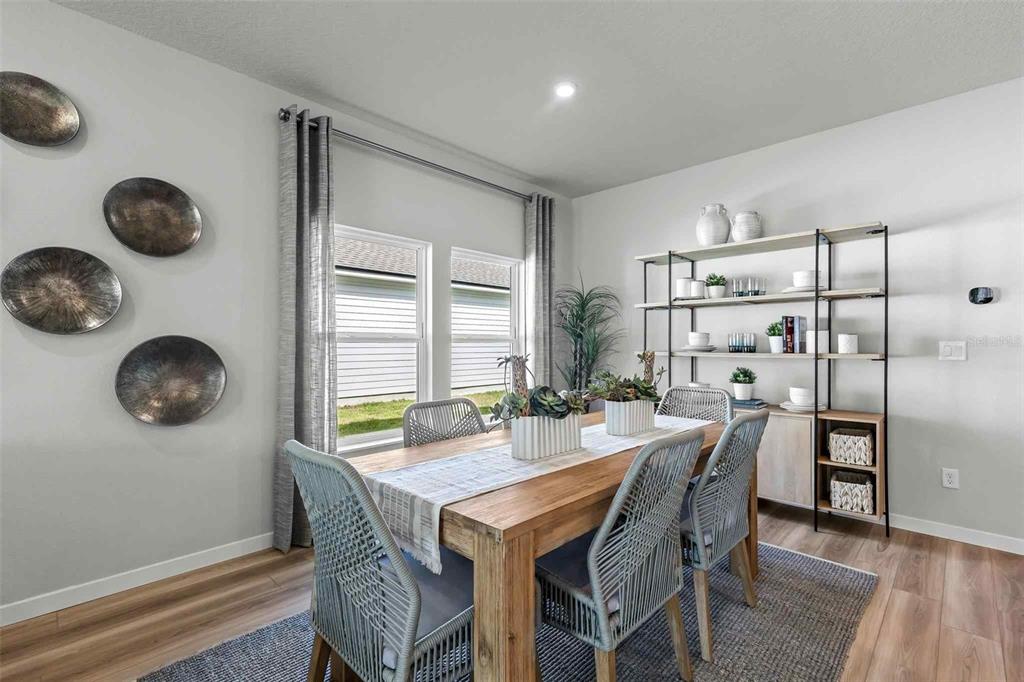 89 Pegasus Road Flagler Beach, FL 32136 - Photo 3 of 35 a view of a dining room with furniture and chandelier