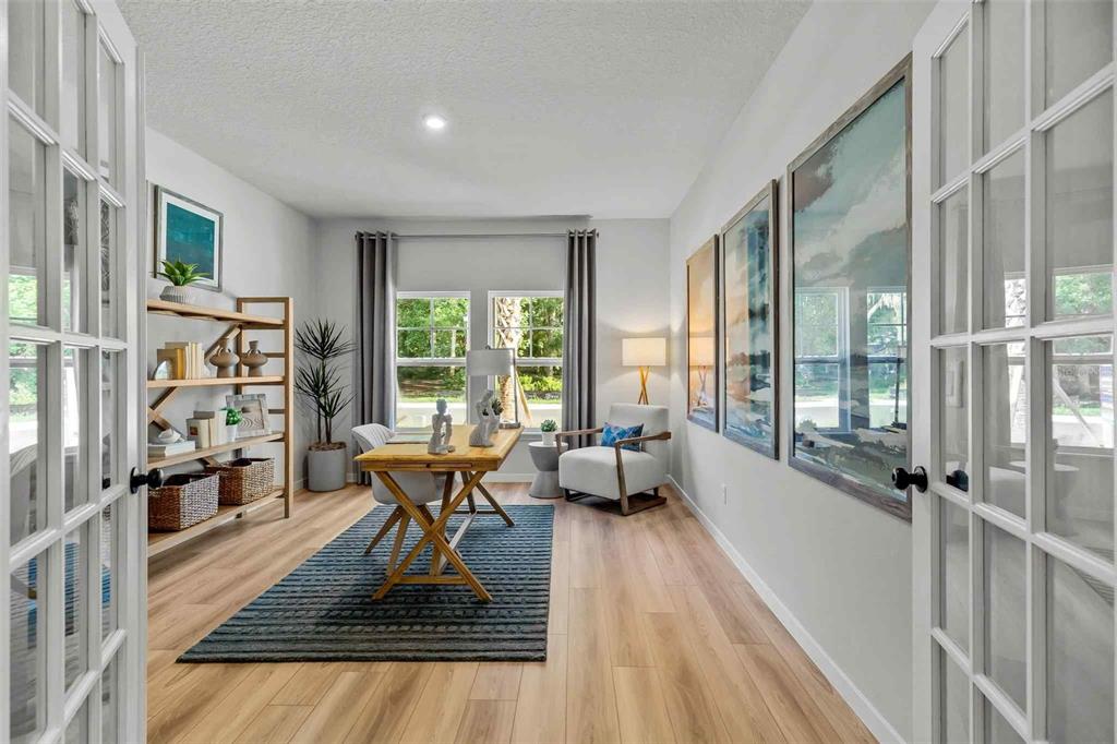 89 Pegasus Road Flagler Beach, FL 32136 - Photo 34 of 35 a living room with furniture rug and a large window