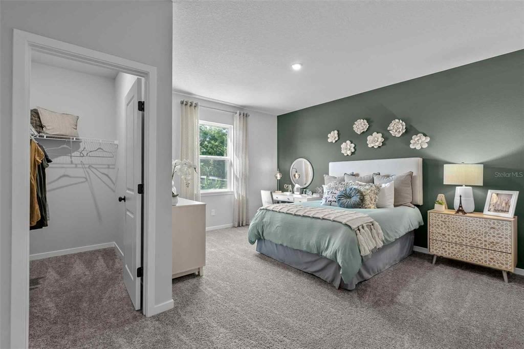 89 Pegasus Road Flagler Beach, FL 32136 - Photo 7 of 35 a bedroom with a bed and a painting on the wall