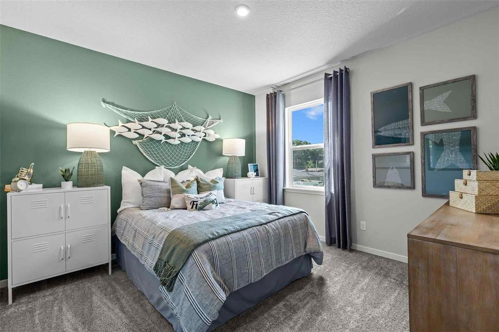 89 Pegasus Road Flagler Beach, FL 32136 - Photo 8 of 35 a bedroom with a large bed and a chandelier