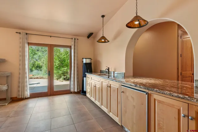 a kitchen with stainless steel appliances granite countertop a sink and a granite counter tops