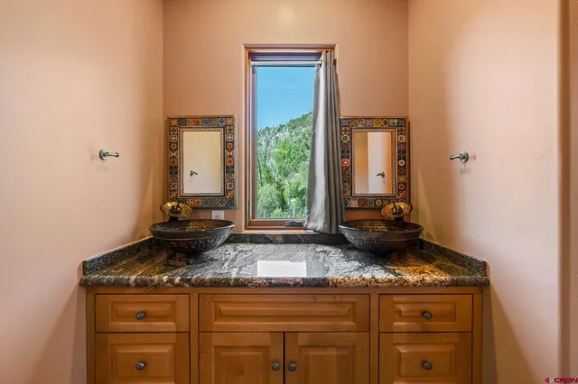 a kitchen with sink and window