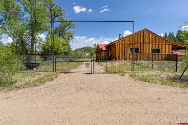 a view of a house next to a yard