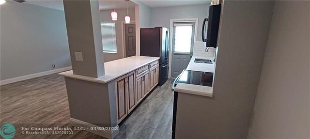 a view of a hallway with windows