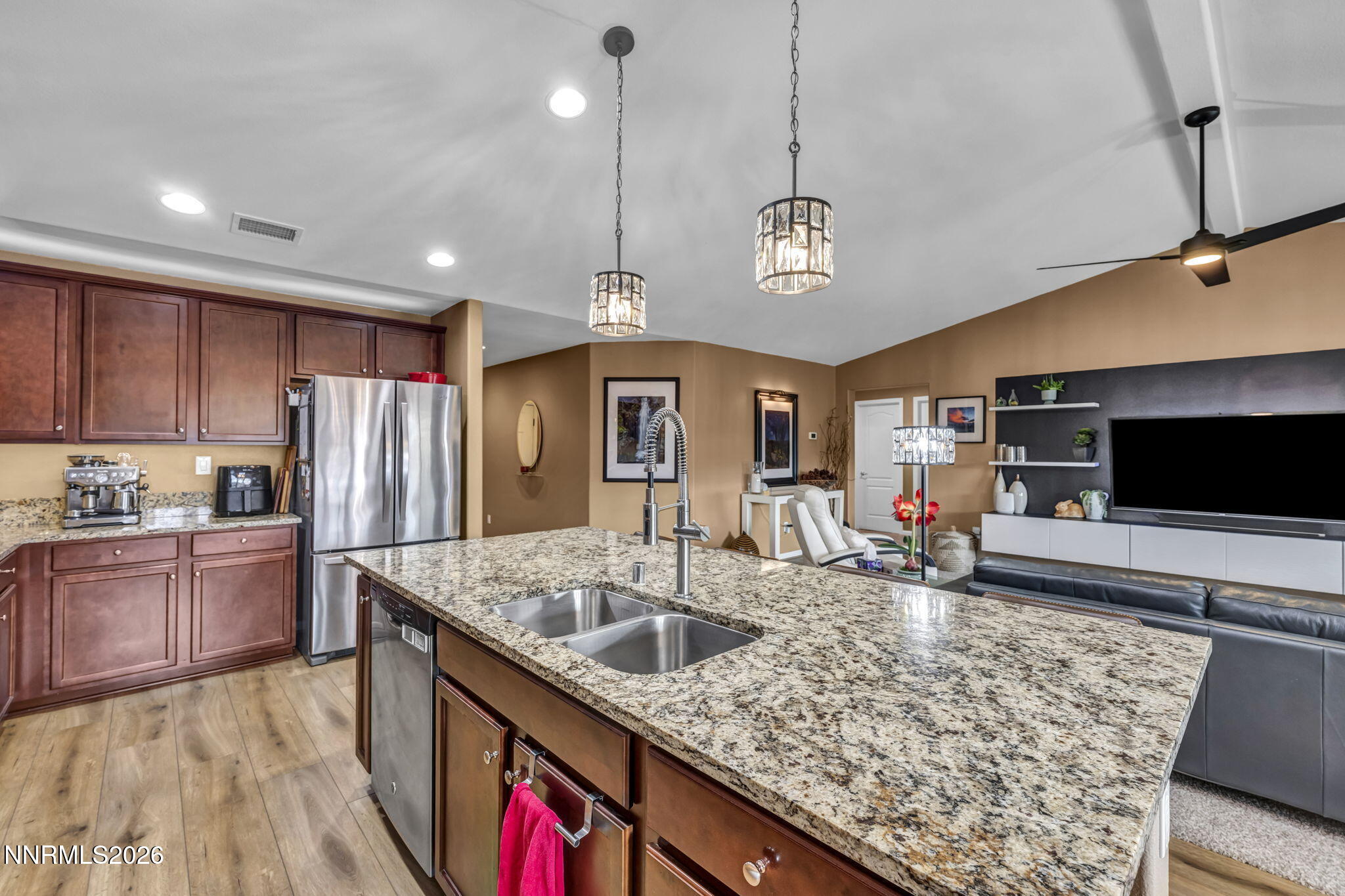 148 Snake Road Dayton, NV 89403 - Photo 13 of 57 a kitchen with stainless steel appliances granite countertop a sink refrigerator and microwave