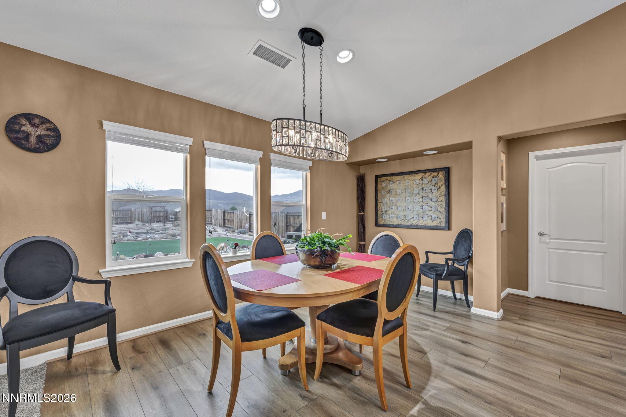 148 Snake Road Dayton, NV 89403 - Photo 18 of 57 a dining room with furniture a chandelier and wooden floor