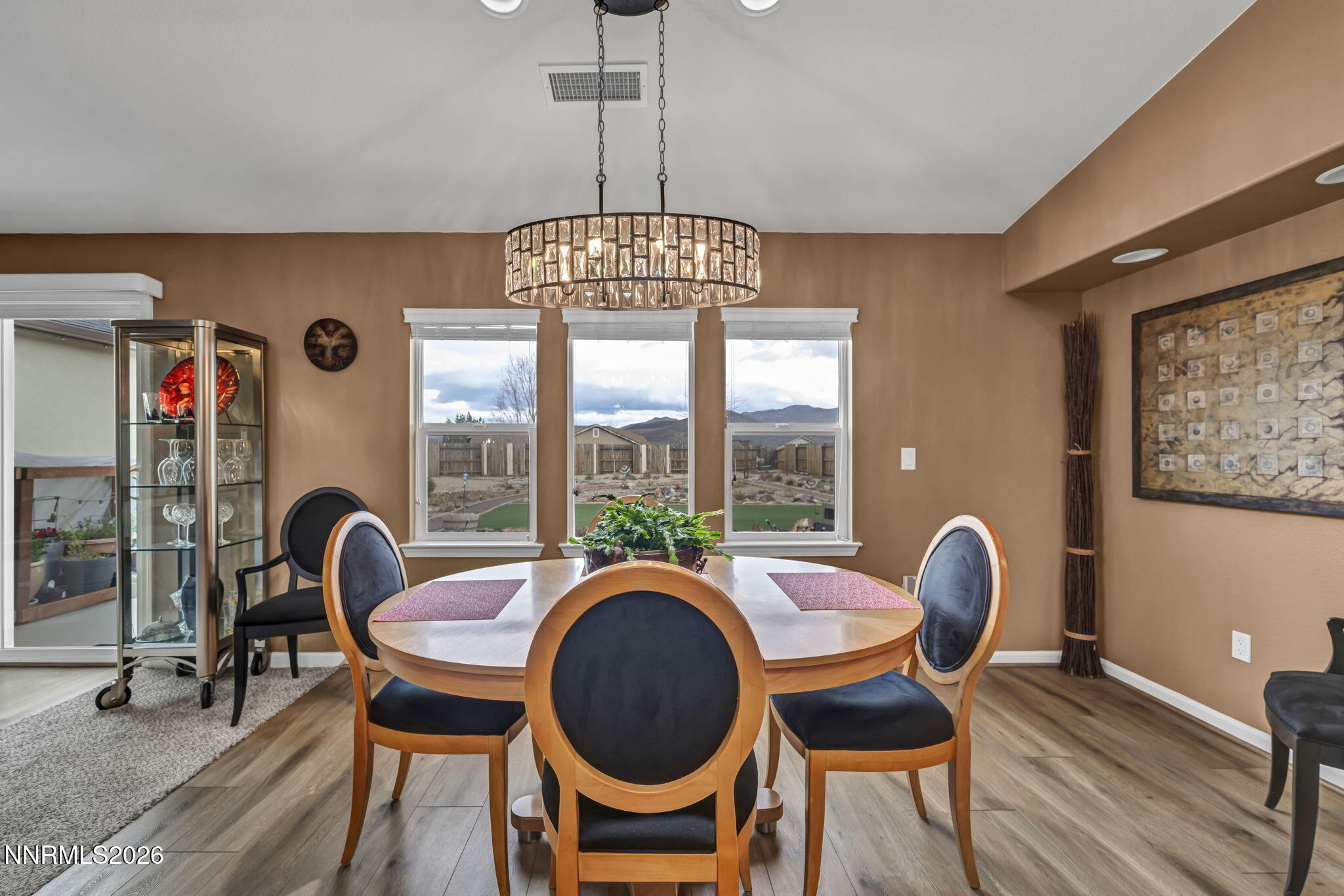 148 Snake Road Dayton, NV 89403 - Photo 19 of 57 a dining room with furniture a chandelier and wooden floor