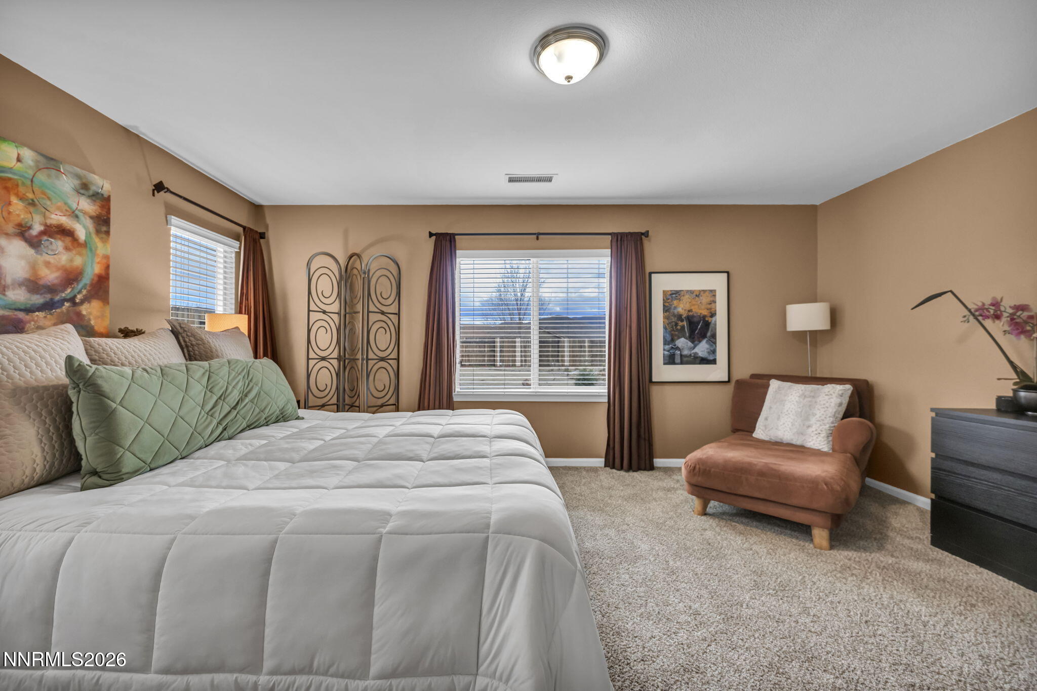 148 Snake Road Dayton, NV 89403 - Photo 21 of 57 a spacious bedroom with a bed and glass window