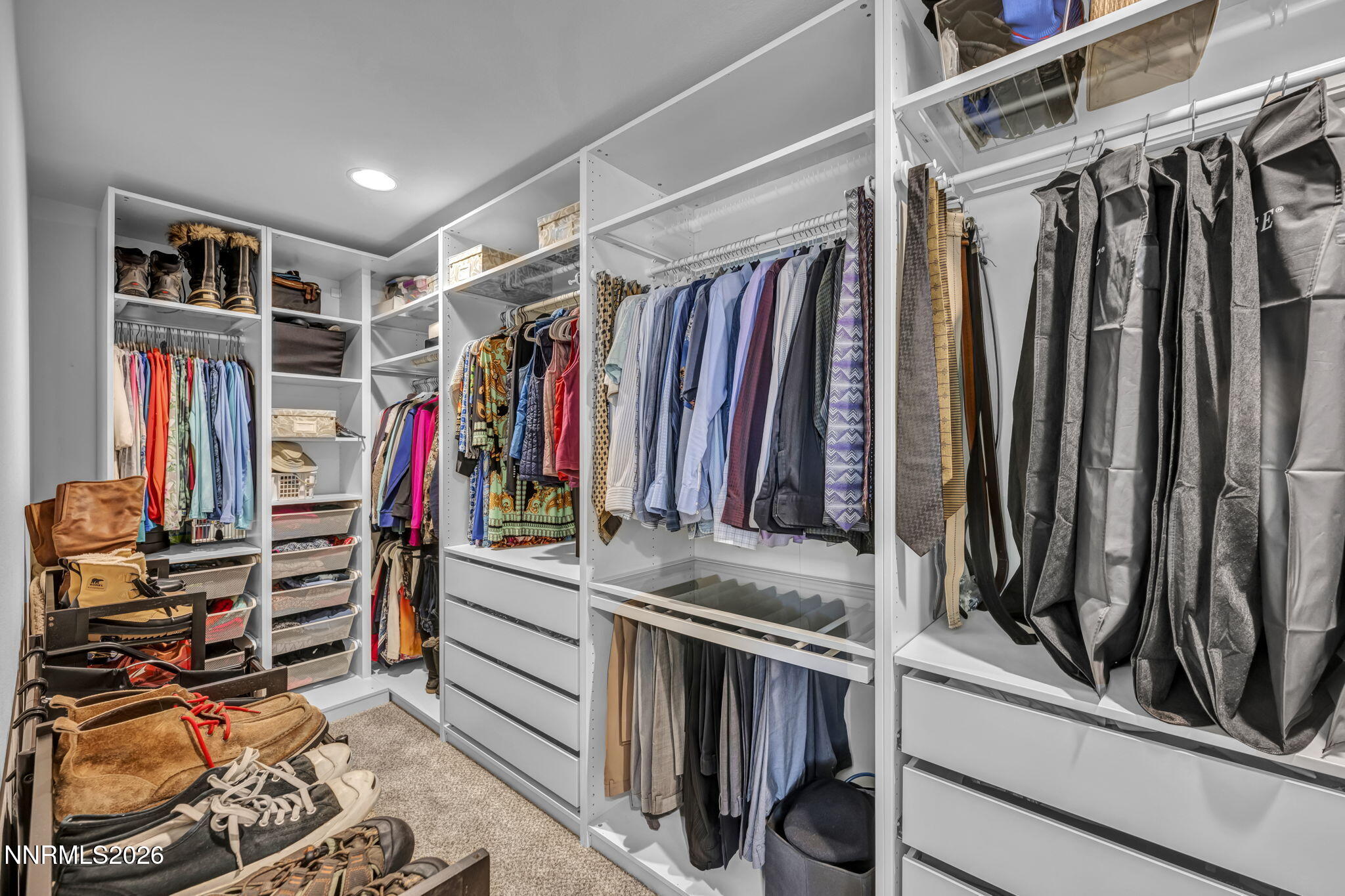 148 Snake Road Dayton, NV 89403 - Photo 23 of 57 a view of walk in closet with clothes and shoes