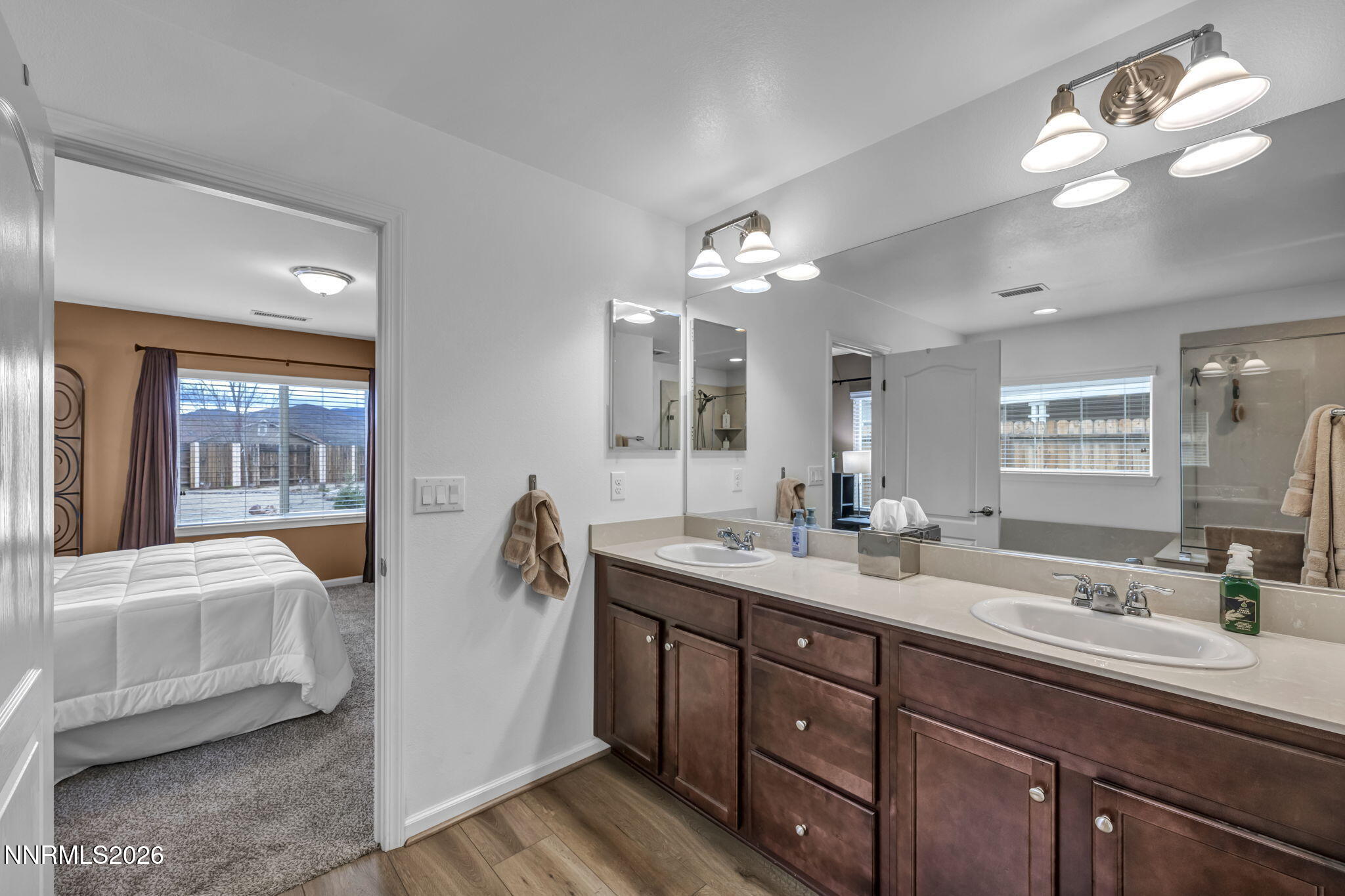 148 Snake Road Dayton, NV 89403 - Photo 25 of 57 a en suite bathroom with a double vanity sink and a mirror