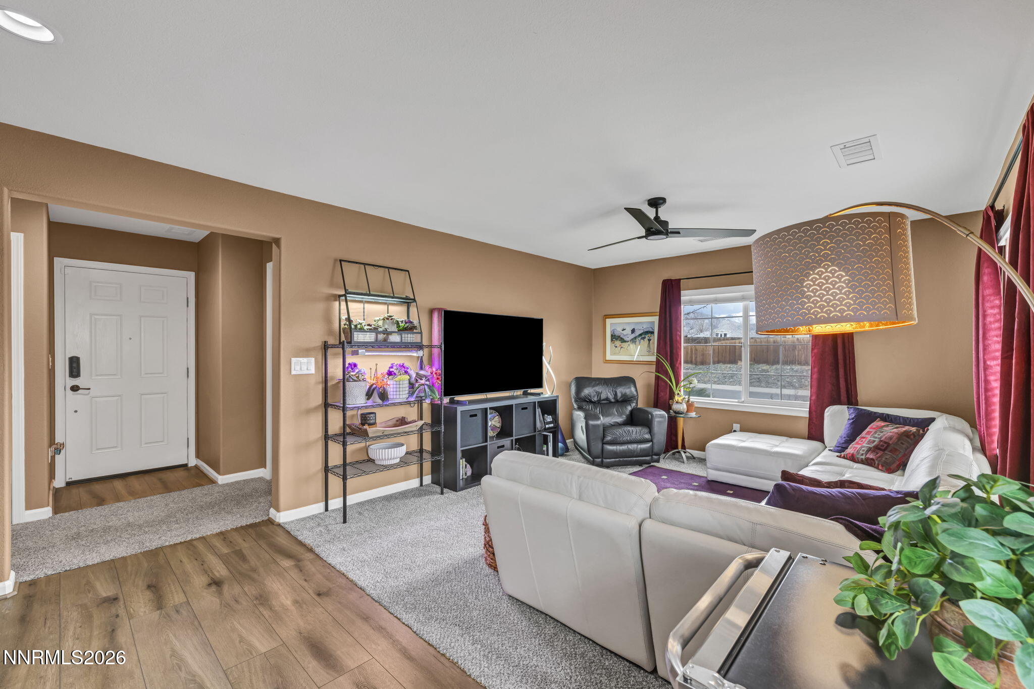 148 Snake Road Dayton, NV 89403 - Photo 29 of 57 a living room with furniture and a flat screen tv