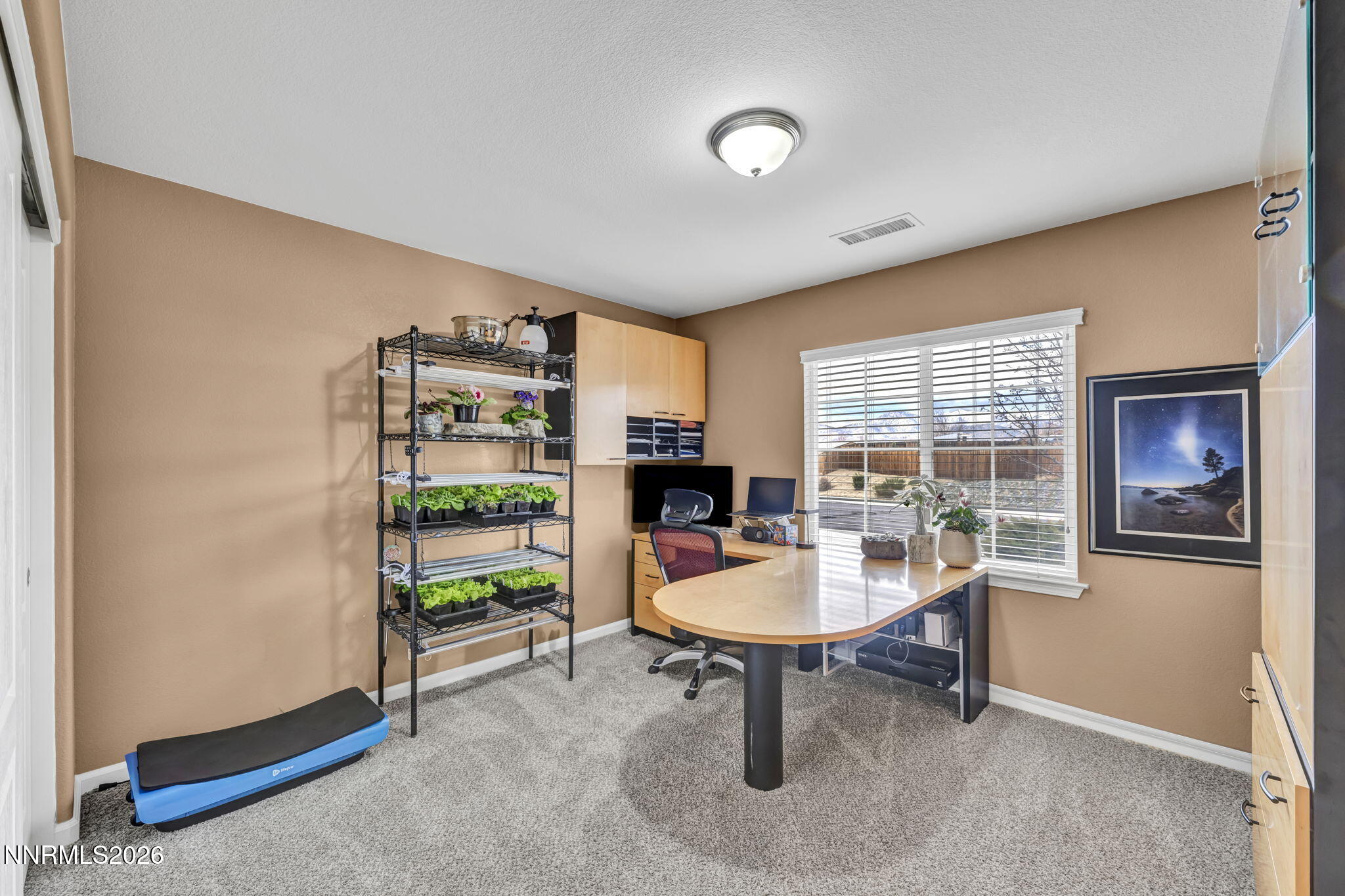 148 Snake Road Dayton, NV 89403 - Photo 35 of 57 a living room with furniture a window and a table
