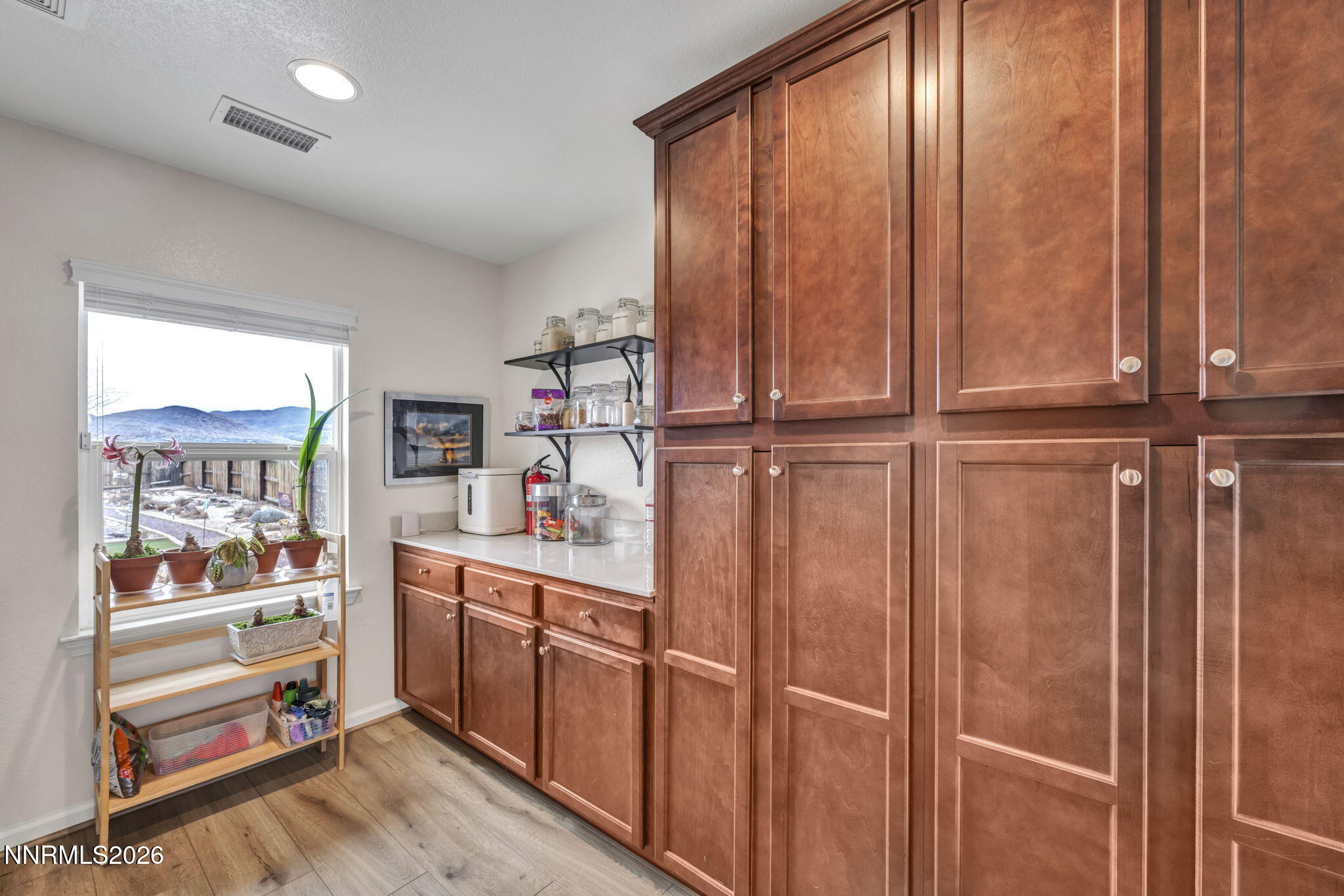148 Snake Road Dayton, NV 89403 - Photo 42 of 57 a kitchen with kitchen island wooden floor and window