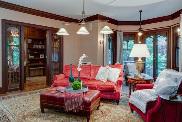 a bedroom with bed and wooden floor