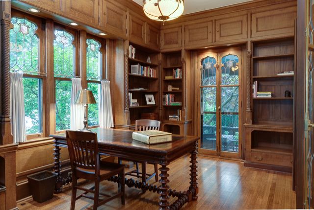 a dining room with furniture and wooden floor