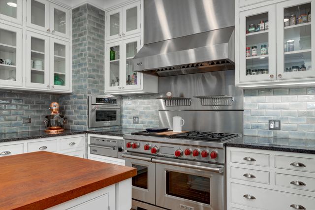 a kitchen with a stove and a sink