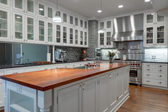 a kitchen with a sink and cabinets