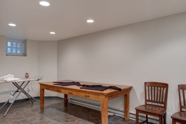 a room with a table and chairs