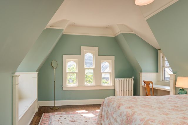 a bedroom with a bed and window