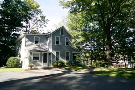 a front view of a house with a yard