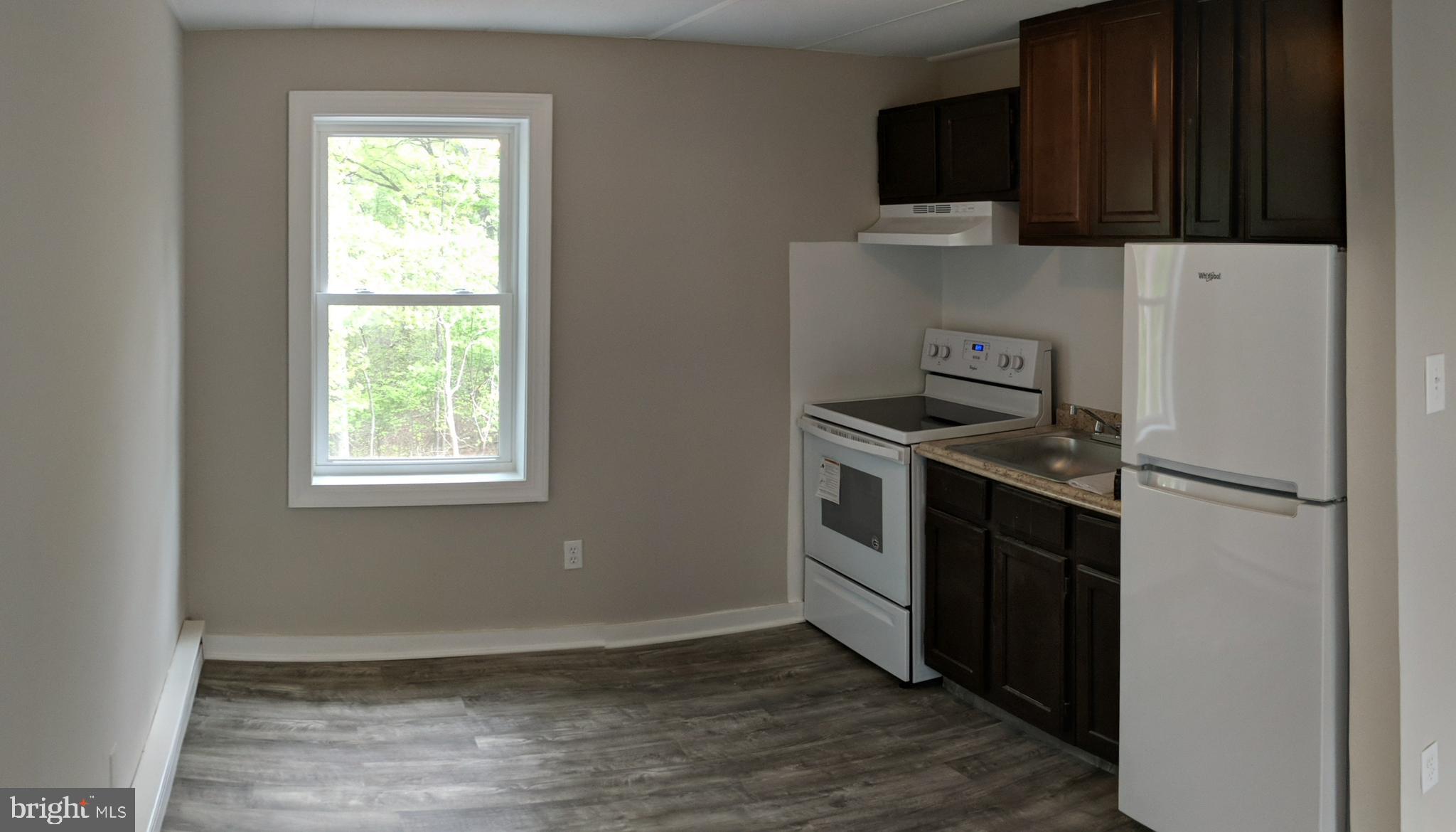 424 Trenton Road Browns Mills, NJ 08015 - Photo 15 of 109 a kitchen with a refrigerator stove and microwave