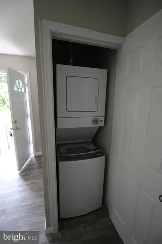 a kitchen with a refrigerator and a sink