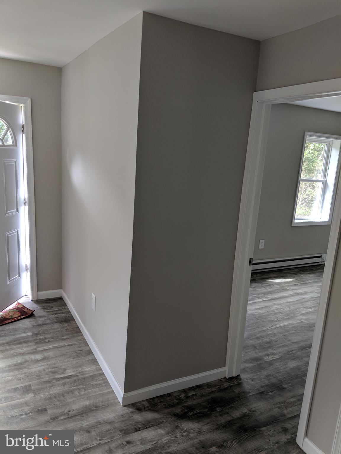 424 Trenton Road Browns Mills, NJ 08015 - Photo 54 of 109 an empty room with wooden floor and windows