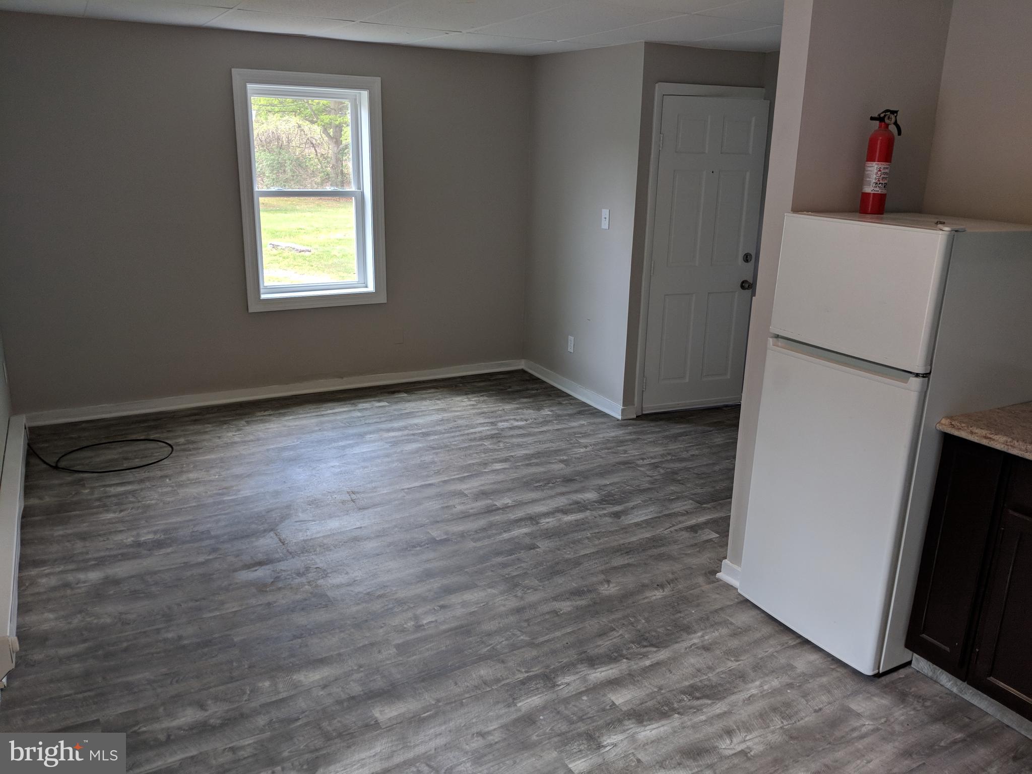 424 Trenton Road Browns Mills, NJ 08015 - Photo 6 of 109 a view of a room with wooden floor and a window