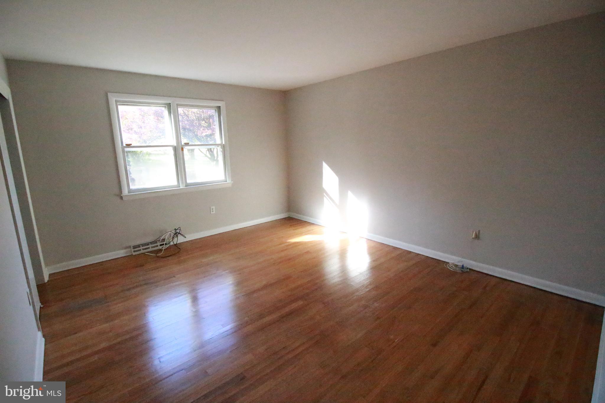 424 Trenton Road Browns Mills, NJ 08015 - Photo 65 of 109 an empty room with wooden floor and windows