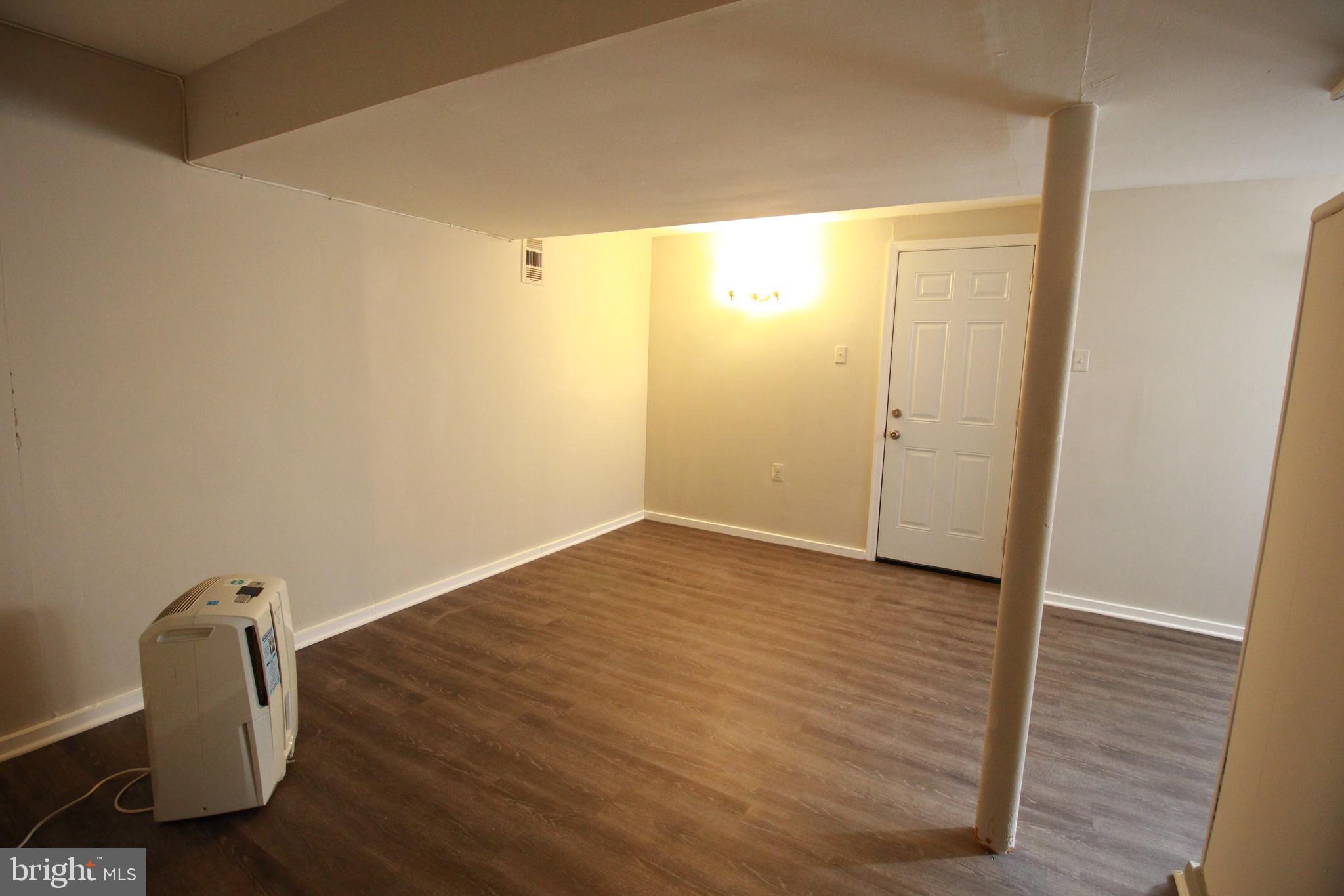 424 Trenton Road Browns Mills, NJ 08015 - Photo 92 of 109 a view of a room with wooden floor and bathroom