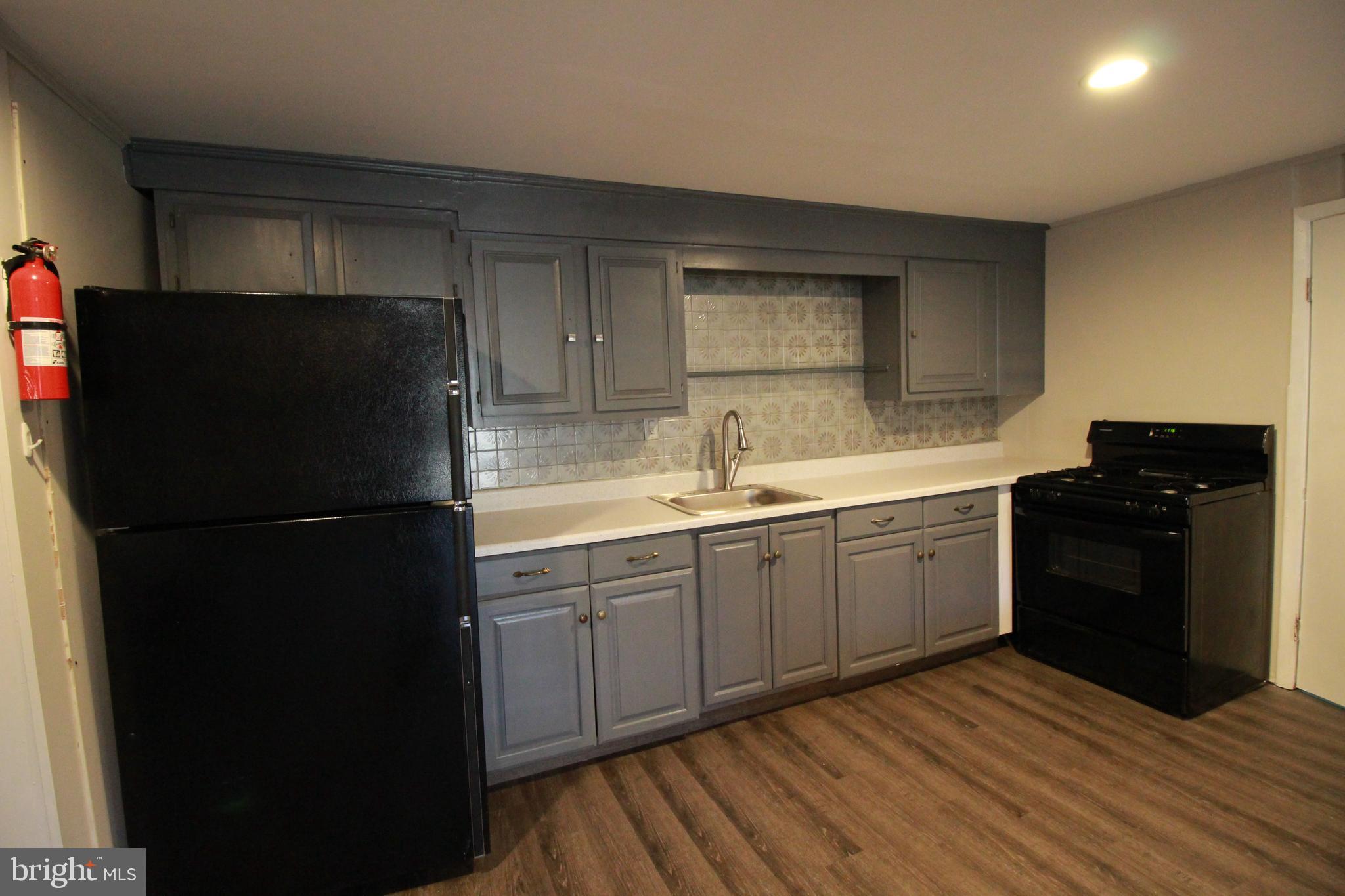 424 Trenton Road Browns Mills, NJ 08015 - Photo 98 of 109 a kitchen with a refrigerator and a sink