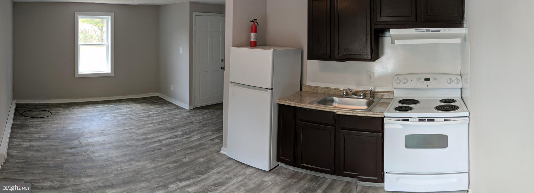 424 Trenton Road Browns Mills, NJ 08015 - Photo 10 of 109 a kitchen with a stove and a microwave