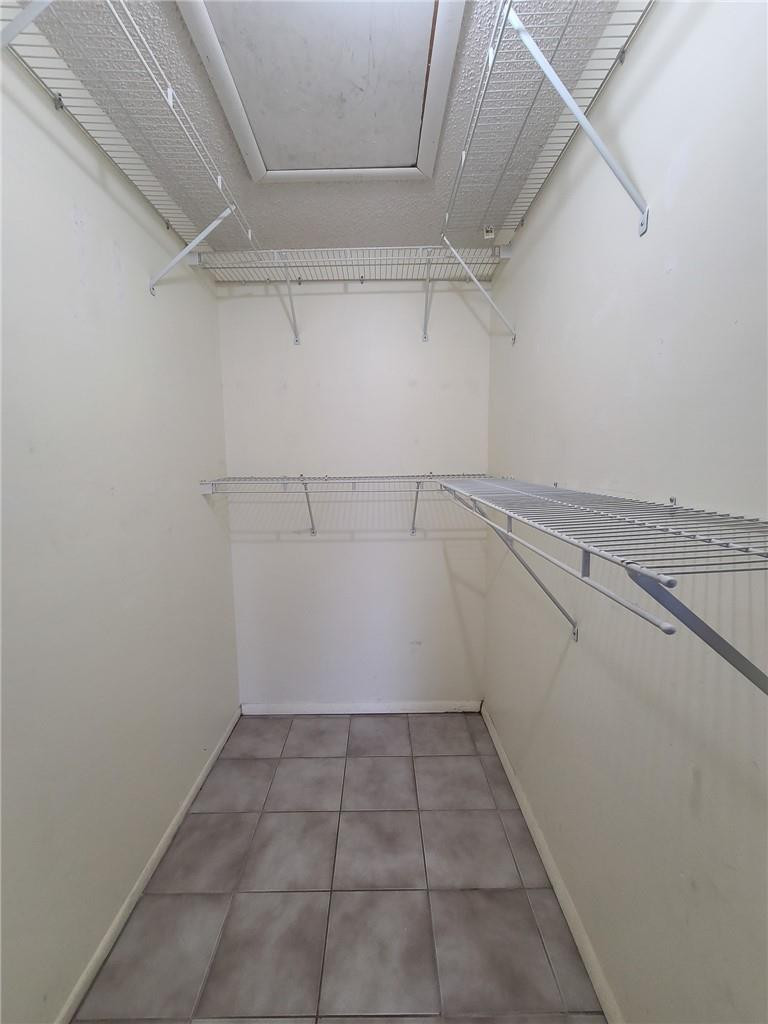 8301 Sands Point Boulevard, Unit 306S Tamarac, FL 33321 - Photo 11 of 13 a view of a room with racks on the wall