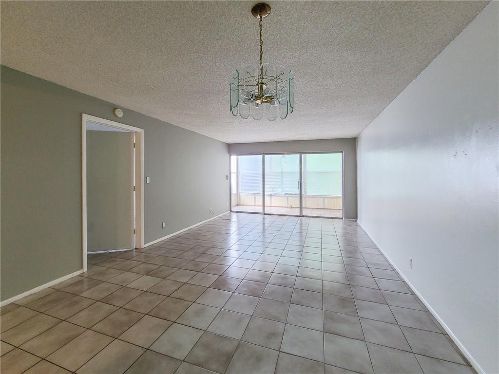 8301 Sands Point Boulevard, Unit 306S Tamarac, FL 33321 - Photo 3 of 13 a view of an empty room with a window