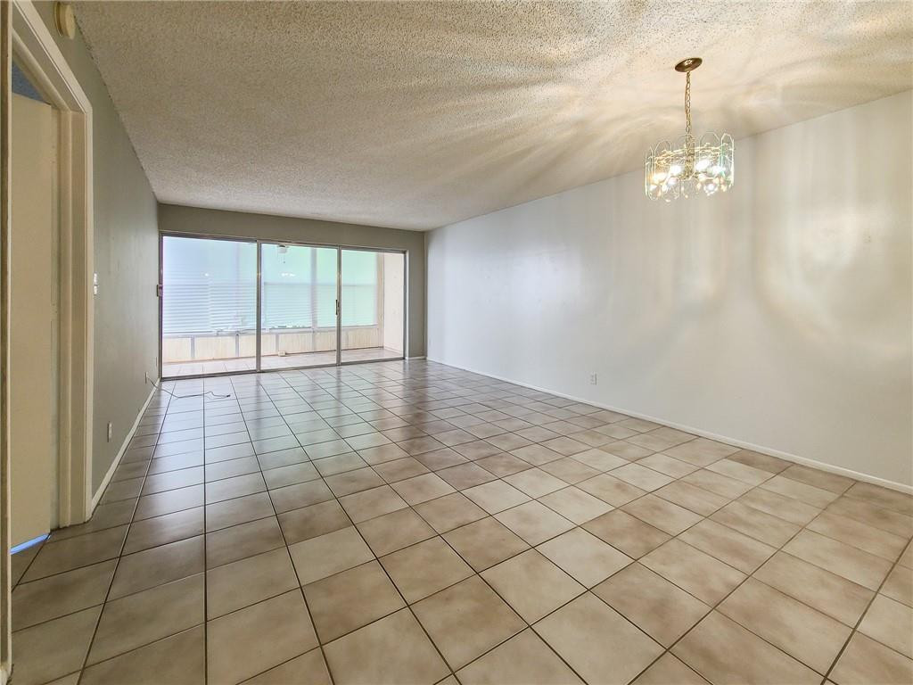 8301 Sands Point Boulevard, Unit 306S Tamarac, FL 33321 - Photo 4 of 13 a view of an empty room and window