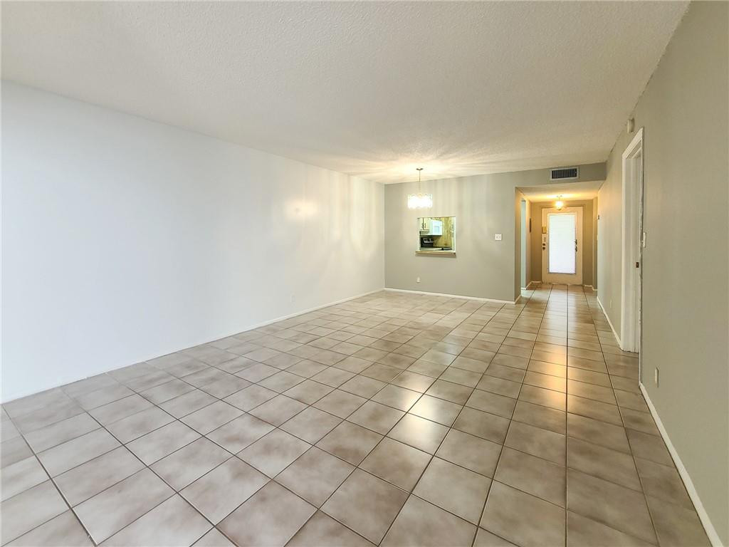 8301 Sands Point Boulevard, Unit 306S Tamarac, FL 33321 - Photo 5 of 13 a view of a hallway