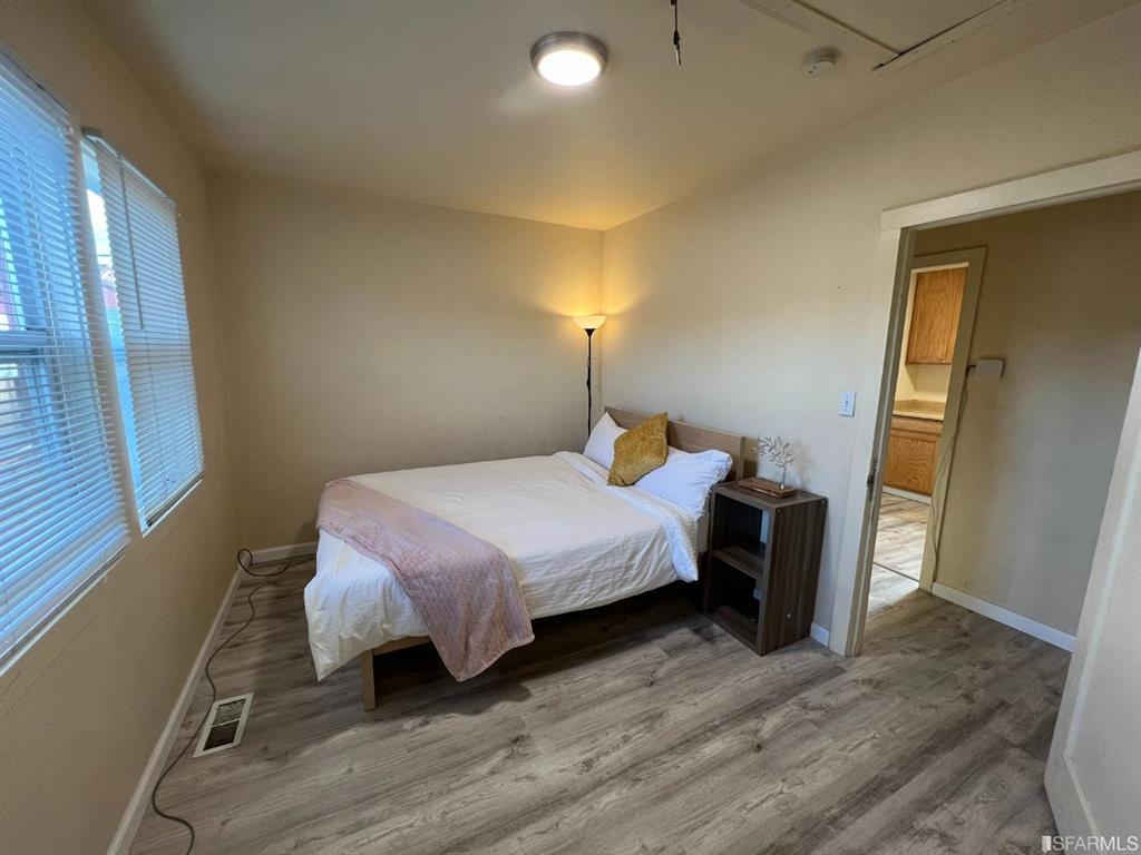 940 Mariposa Street Rodeo, CA 94572 - Photo 8 of 21 a bed room with a bed and a night stand